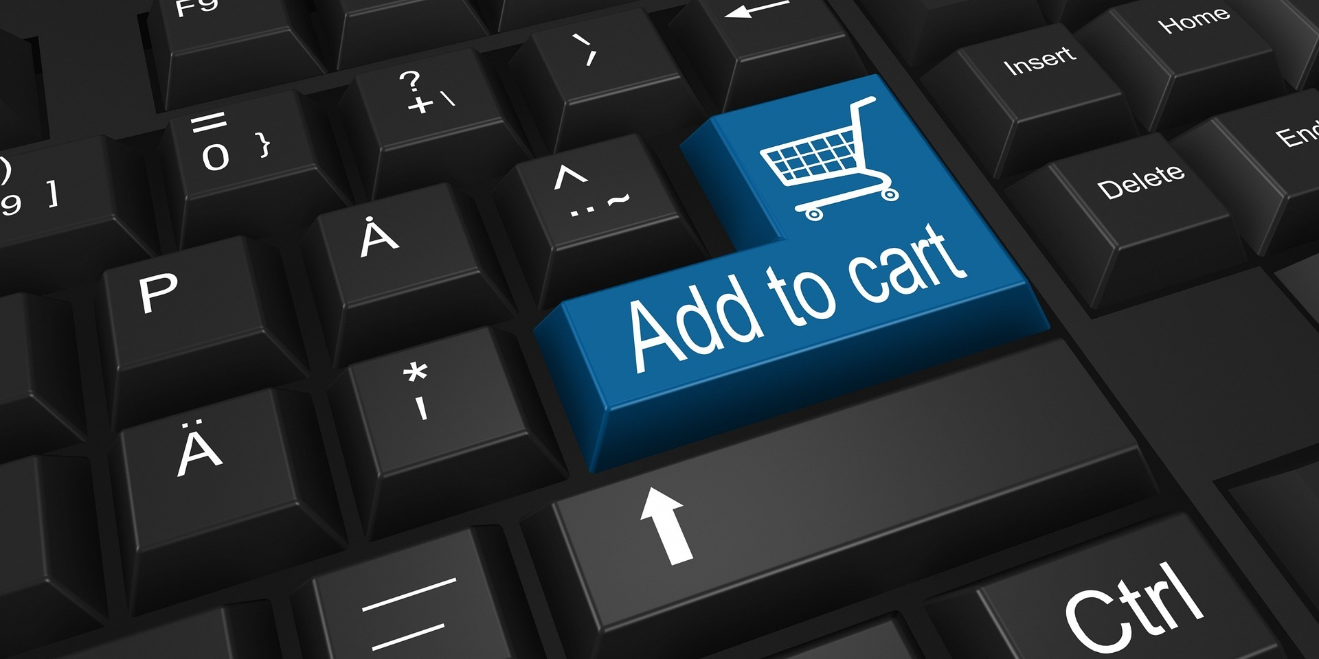A close-up of a black keyboard with a blue "Add to cart" key featuring a shopping cart icon, representing online shopping and ecommerce businesses. 